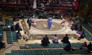 Joe Louis watches sumo wrestling